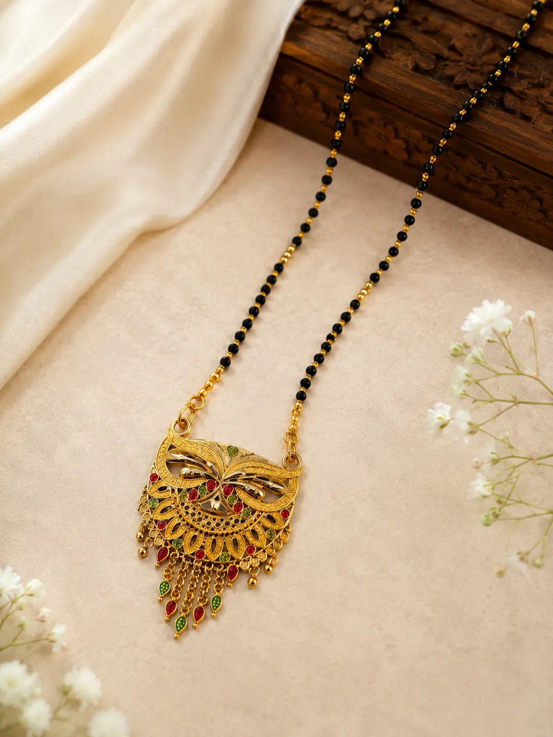 Gold Plated Traditional Black Beads Mangalsutra with Designer Peacock Tassel Pendant