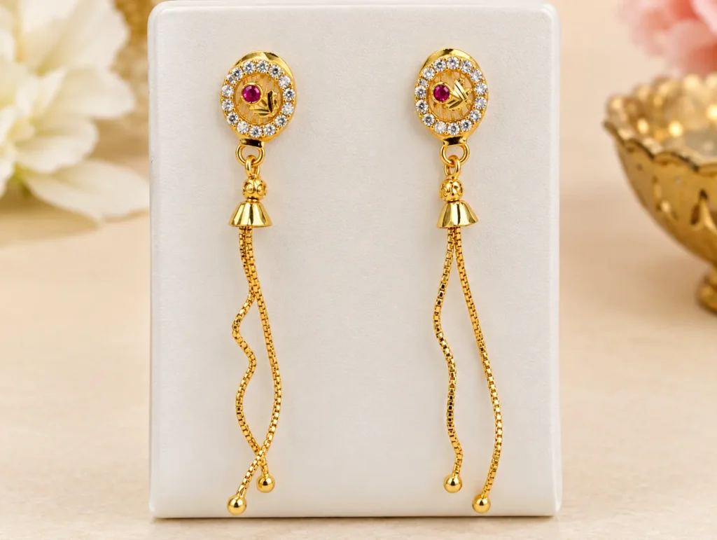 Gold plated long chain tassel earrings with red stone and AD stone work